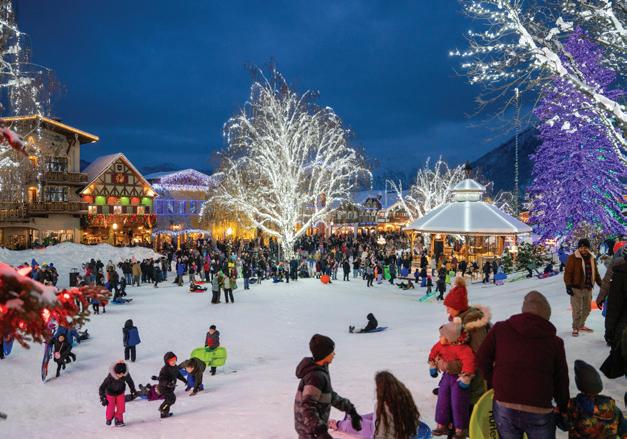 Families enjoying hot cocoa at Leavenworth Christmas Lighting Festival 2025.