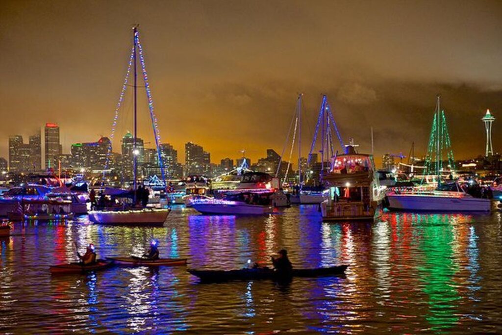 Christmas cruises and boat parades Seattle 2025 — festive boats illuminated on Lake Union with the Seattle skyline in view